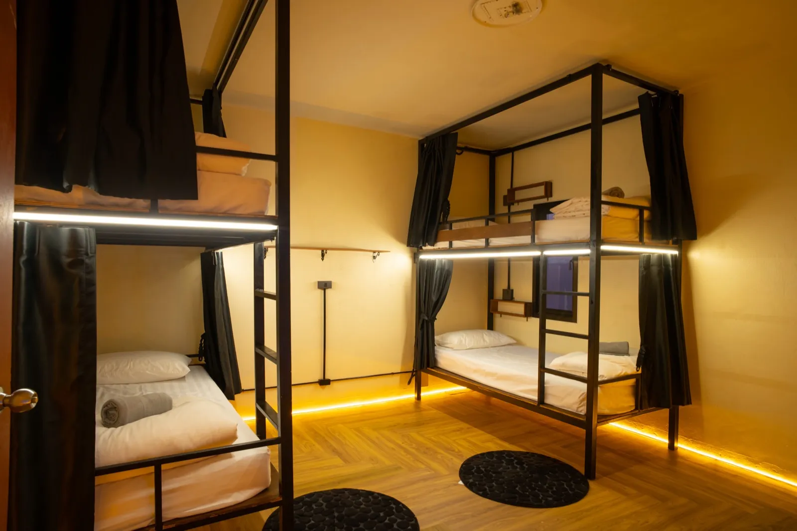 Air-conditioned 4-bed dorm beds with privacy curtains at The Hub Laidback Hostel, Ao Nang Beach